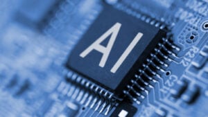 AI stocks to Buy, Close-up of letters "AI" written on a computer chip, symbolizing artificial intelligence and AI stocks. ai chip stocks