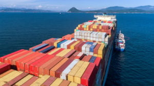 a cargo ship in the middle of the ocean representing TOPS stock