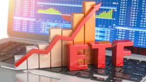 graphic of the phrase ETF sitting on a computer in front of an increasing line graph on top of a bar graph. Best Funds for Aggressive Investors. Best Growth ETFs