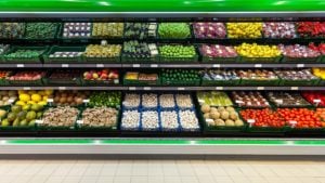 Fresh fruits and vegetables on the shelf in the supermarket