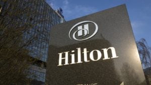 the sign in front of a Hilton (HLT) hotel