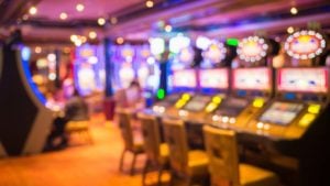 a room of slot machines in a casino to represent gambling stocks