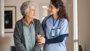 A nurse is helping a older woman. Elder care. Senior care.