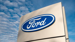 Ford dealership sign against a blue sky.