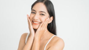 woman smiling with white background