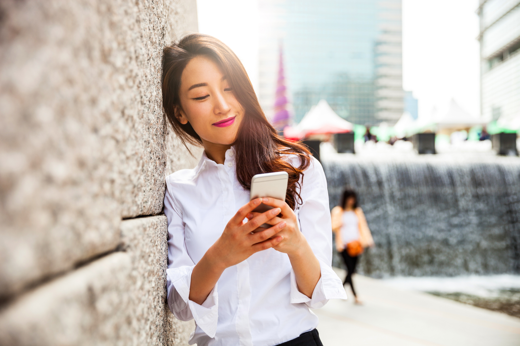 Person using a smartphone outside.