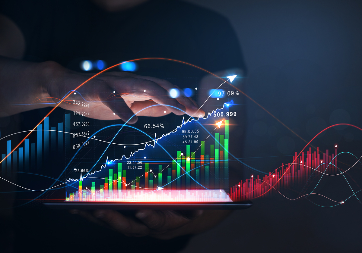 A hand hovering over a holographic stock chart.