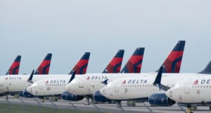 Delta (DAL) Airplanes sit in a row at Kansas City International Airport