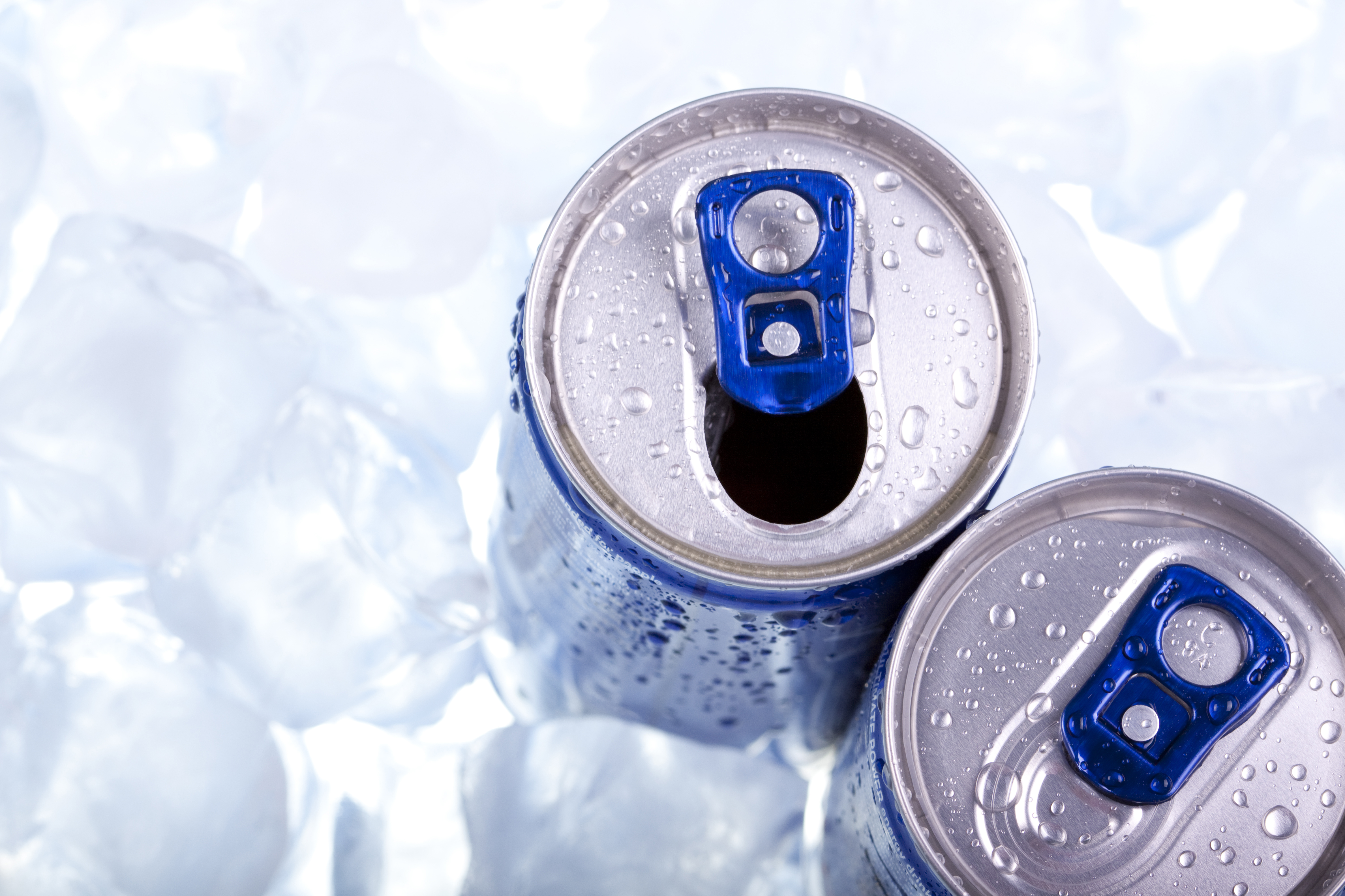 Top of beverage cans in ice. 