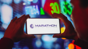 In this photo illustration the Marathon Digital Holdings (MARA) logo seen displayed on a smartphone screen