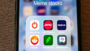 Icons of meme stocks on phone screen. meme stock crashes