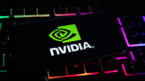 Closeup of mobile phone screen with logo lettering of nvidia corporation on computer keyboard. NVDA stock. Nvidia stock