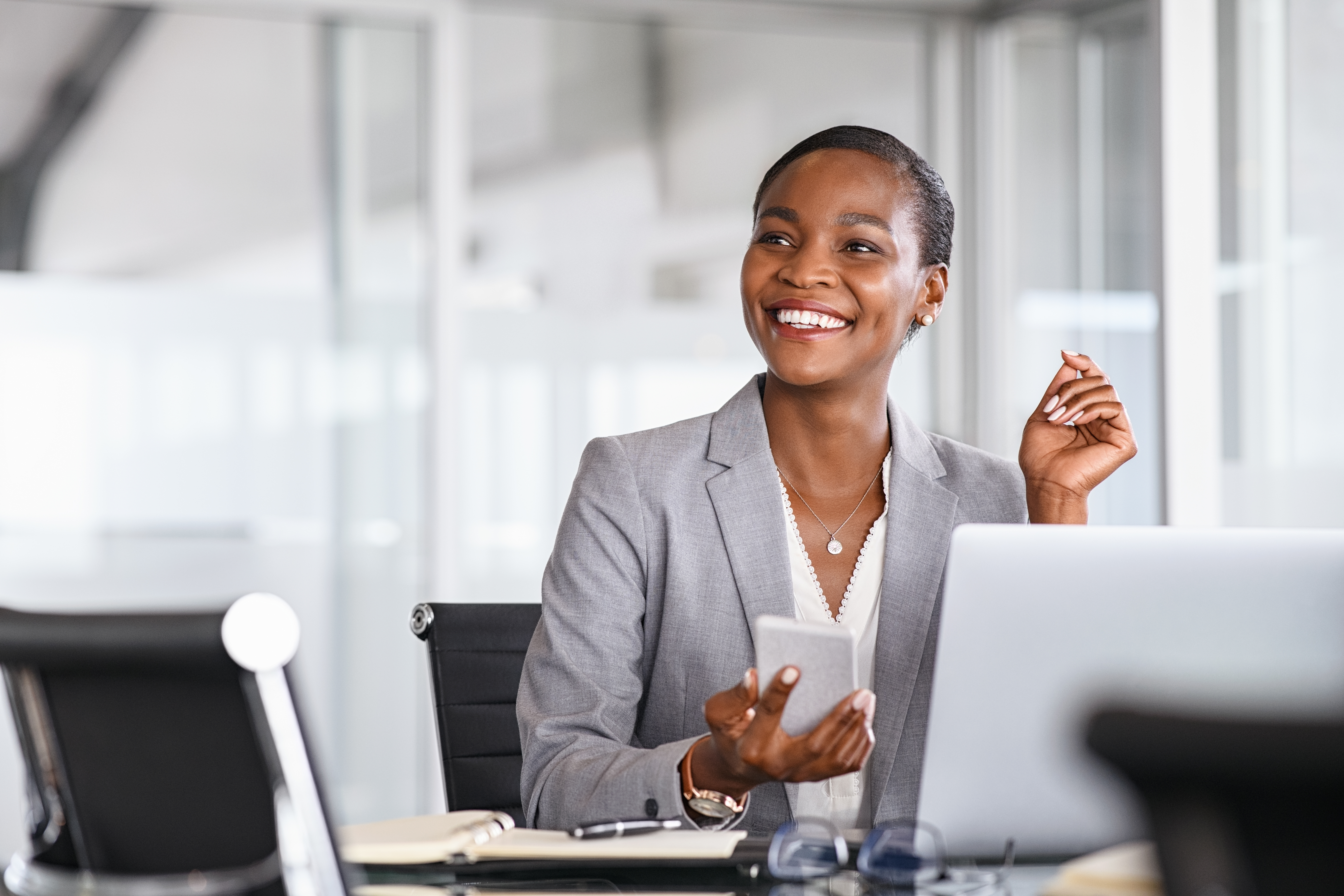 Person engaging with others in a meeting. 