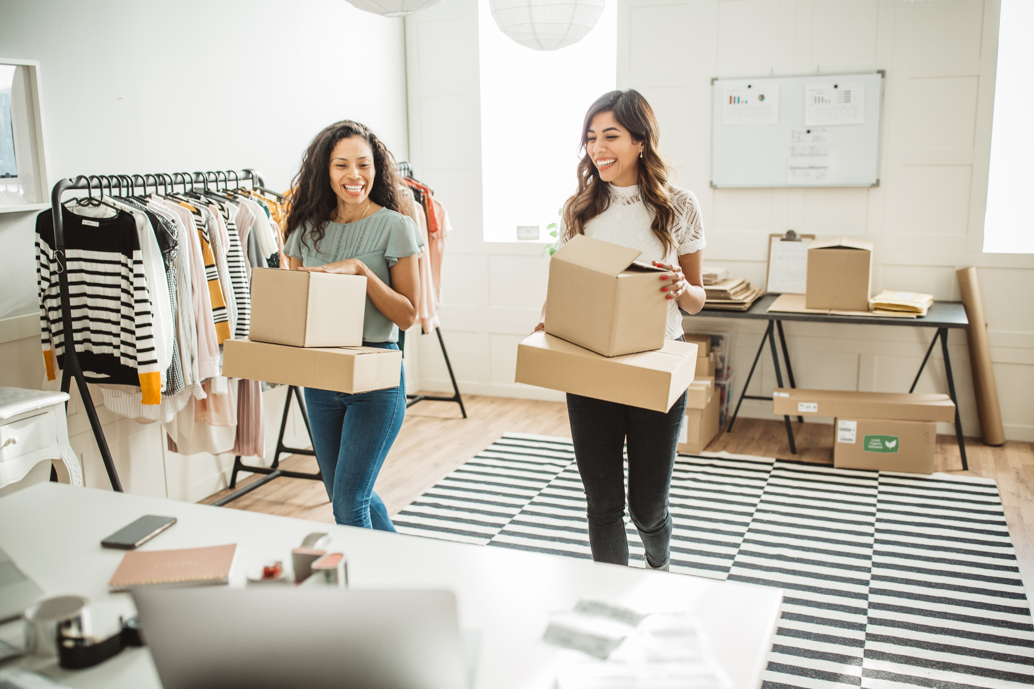 Small business owners with boxes. 