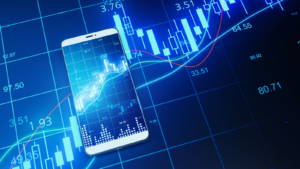 Close up of phone with creative forex chart on blue background. Trade, finance, technology and communication concept. 3D Rendering. Tech Stocks to Buy Before the Bull Market Returns. Tech Stocks to buy