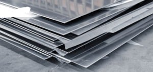 A photo showing a stack of solid steel aluminum plates.