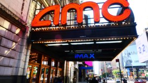 The logo for AMC Entertainment Holdings Inc (AMC) is displayed above a movie theater entrance.