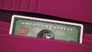 an American Express (AXP) credit card sticking out of someone's pocket