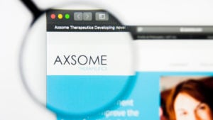 A magnifying glass zooms in on the Axsome Therapeutics, Inc. (AXSM) logo