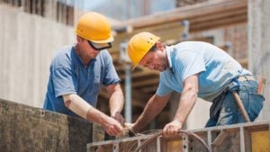 two construction workers on a worksite