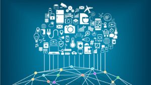 an image of a cloud comprised of various technologies raining down upon the world creating a connected grid.. Internet of things (IOT).