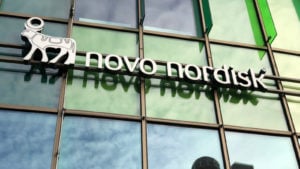 Novo Nordisk logo on a corporate building. NVO stock