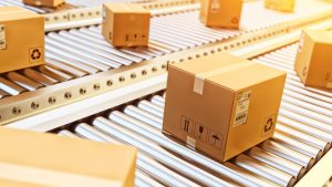 photo of packages and boxes on a conveyor belt