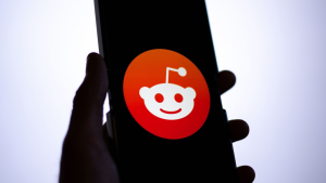 Reddit (RDDT) app logo on a smartphone screen.