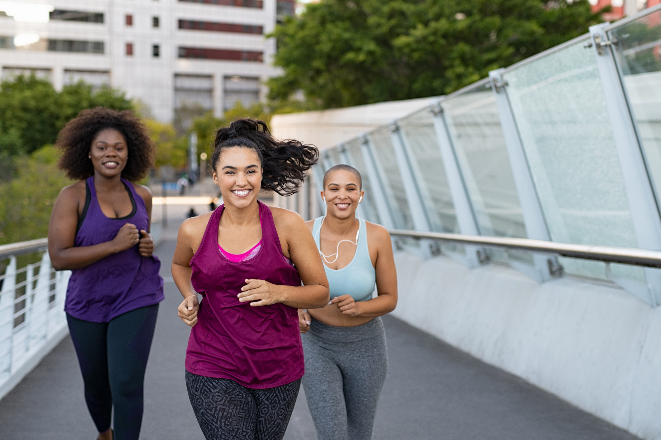 Three friends enjoying a daytime run.