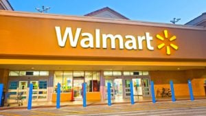 Walmart (WMT) sign on front of Walmart store at sundown