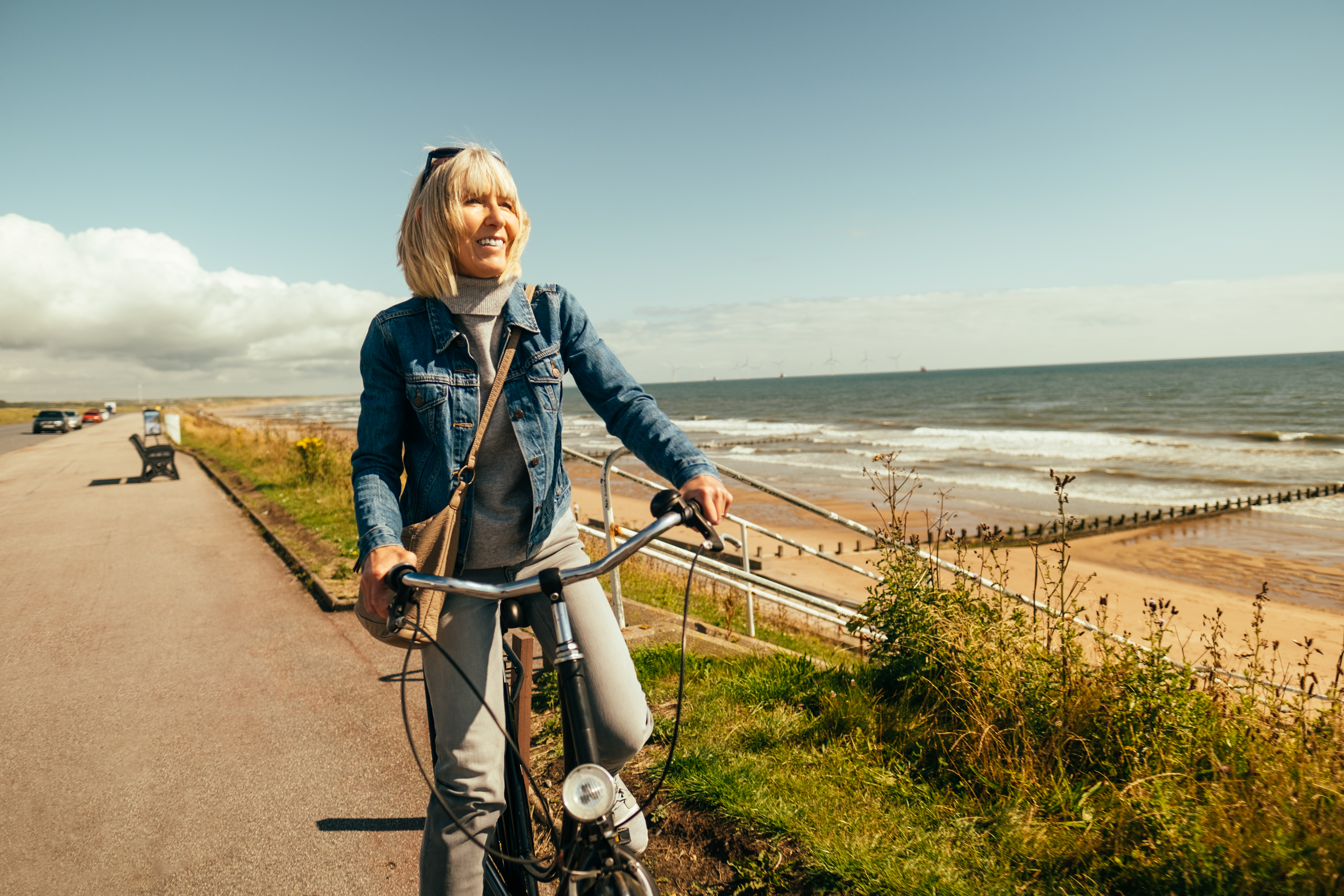 Someone biking along the beach.