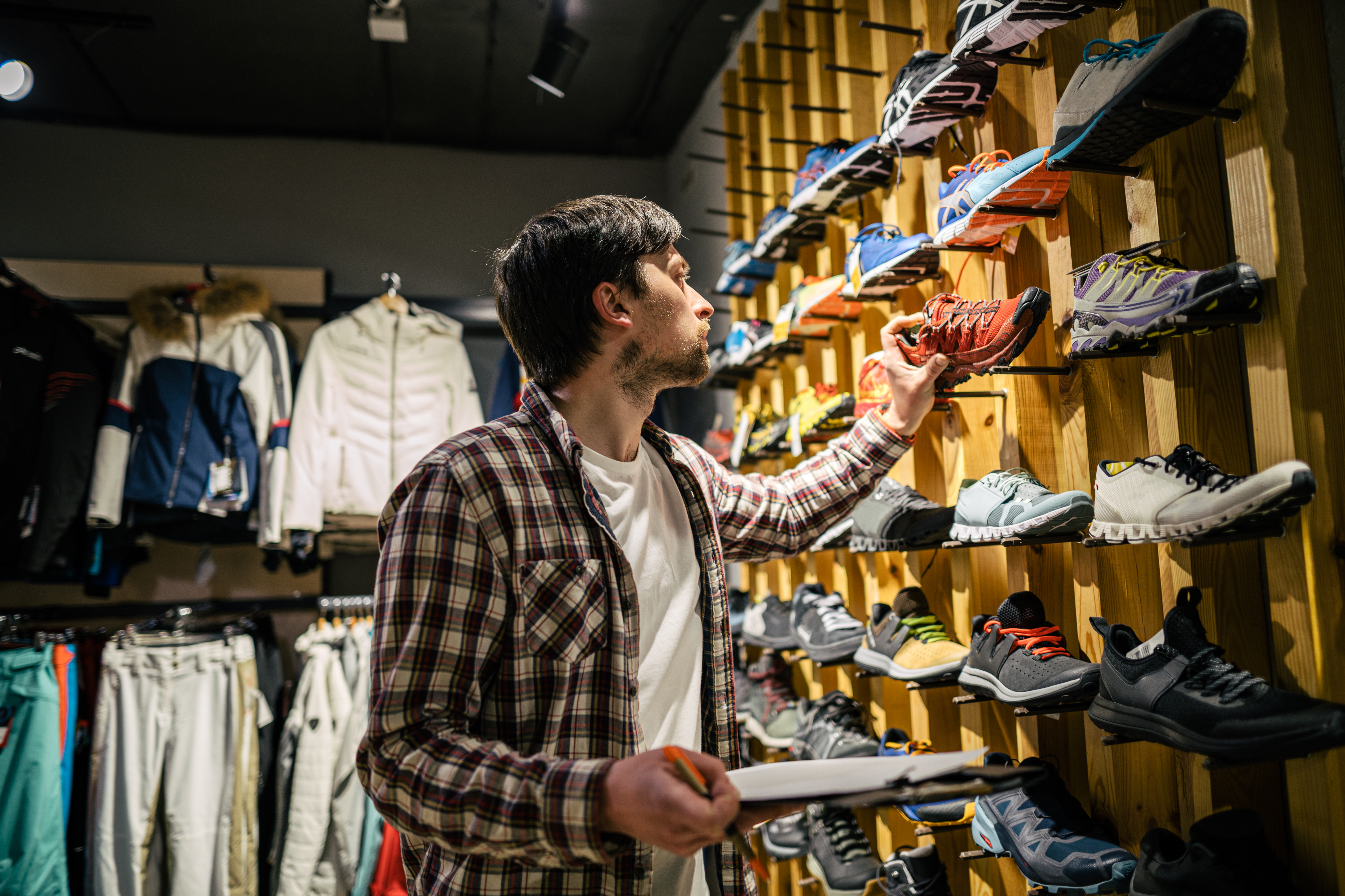 Shopping for sneakers in a store.