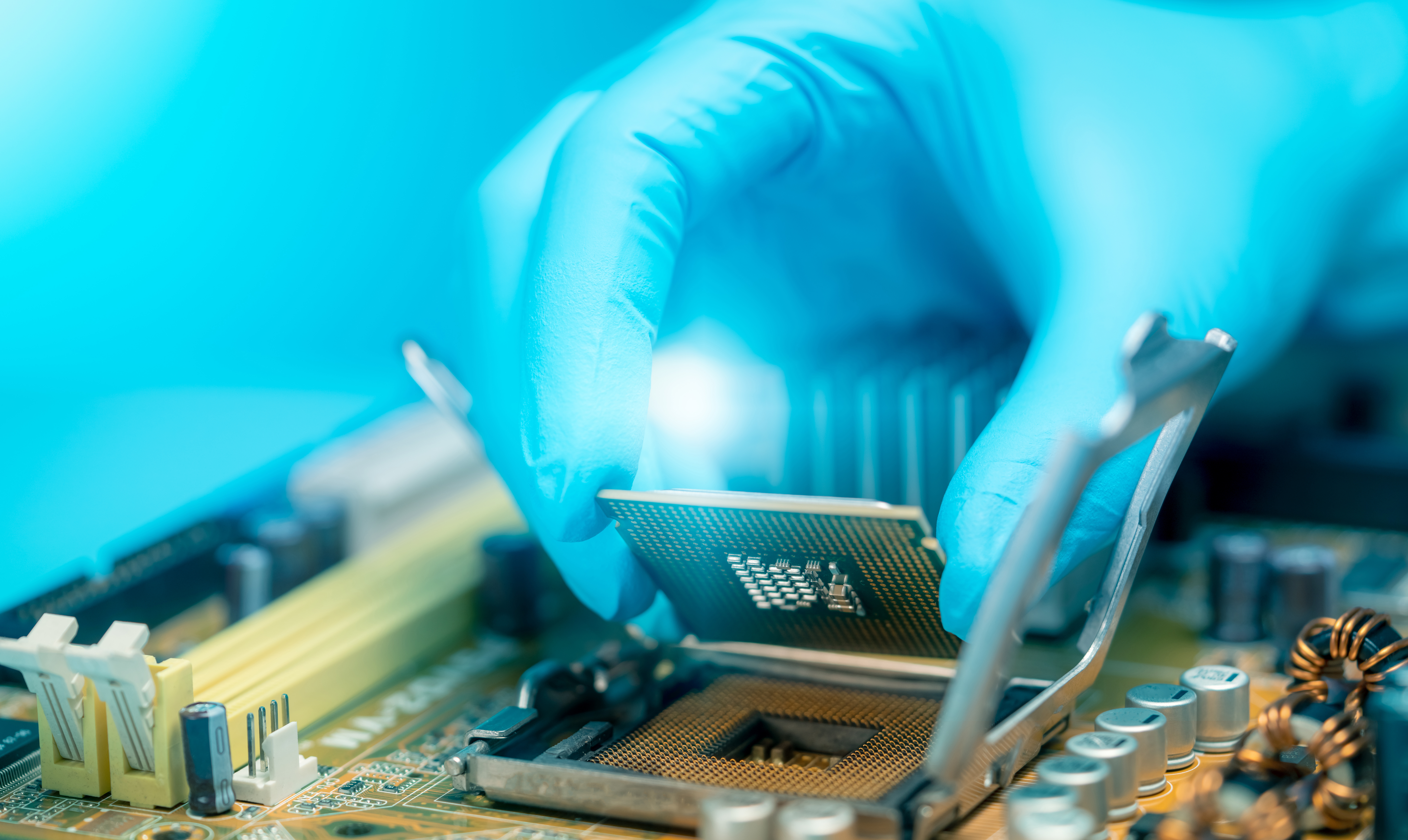 A chip being placed on a circuit board