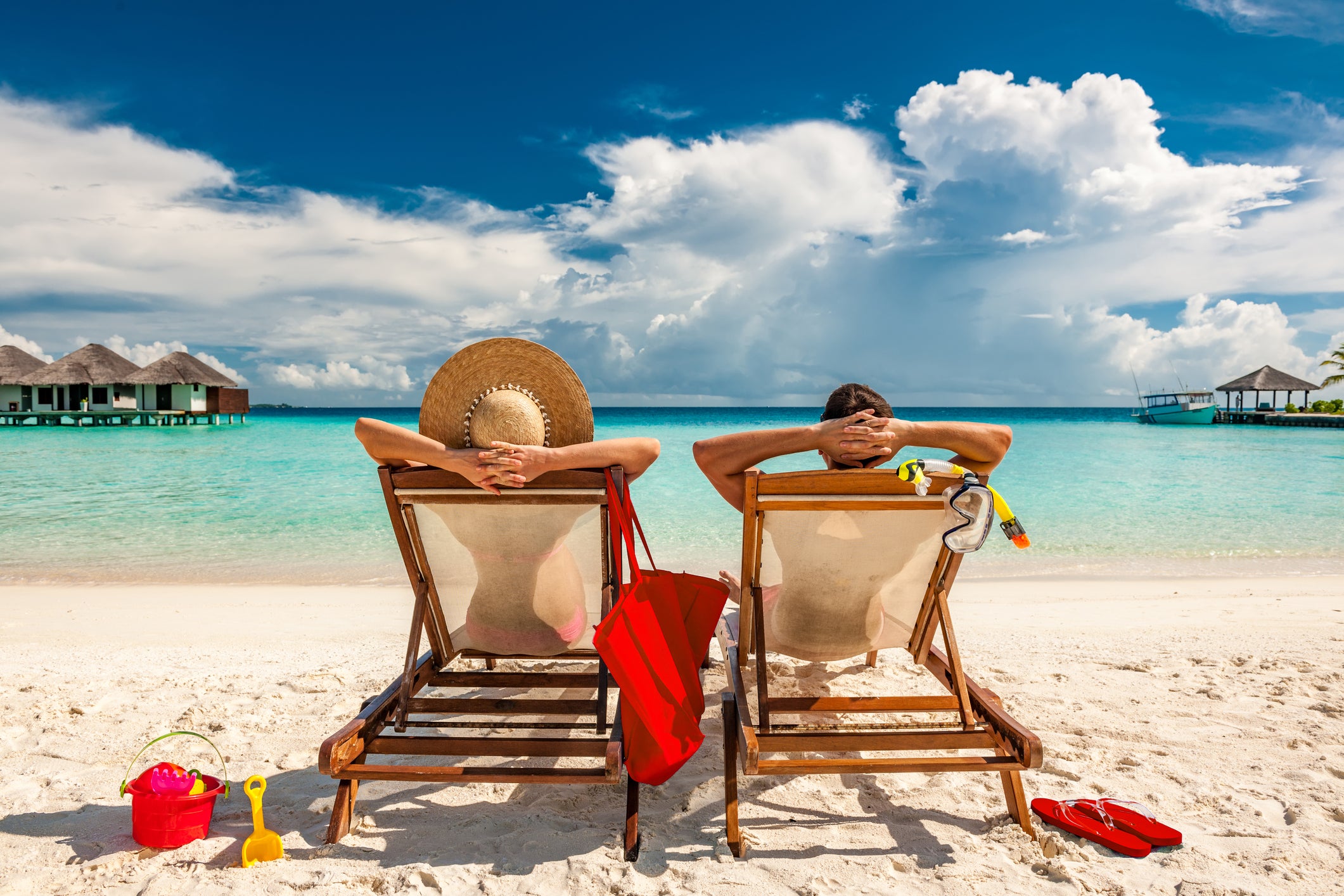 A couple enjoying a sunny beach getaway.