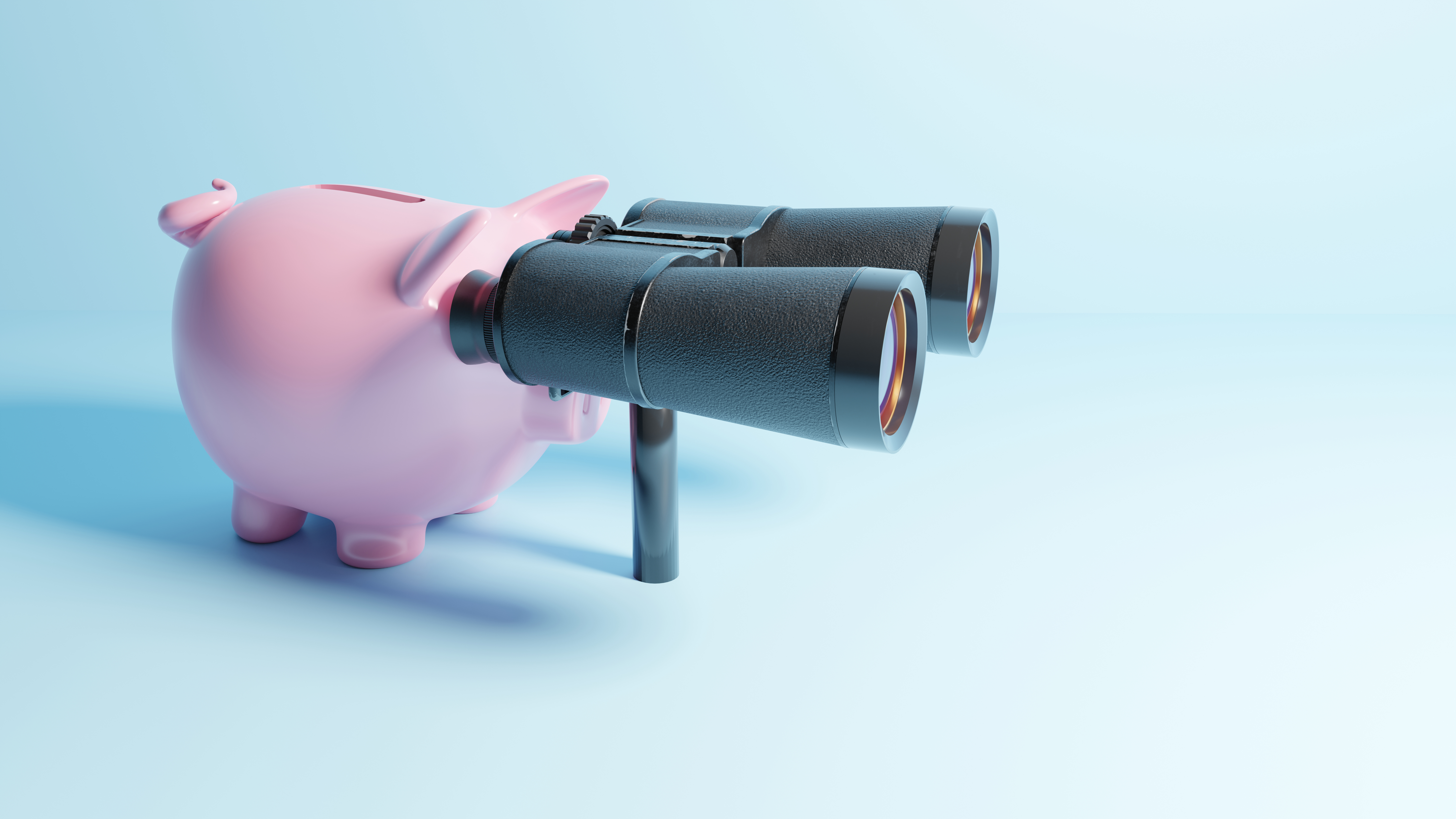 A piggy bank with binoculars looking into the distance.