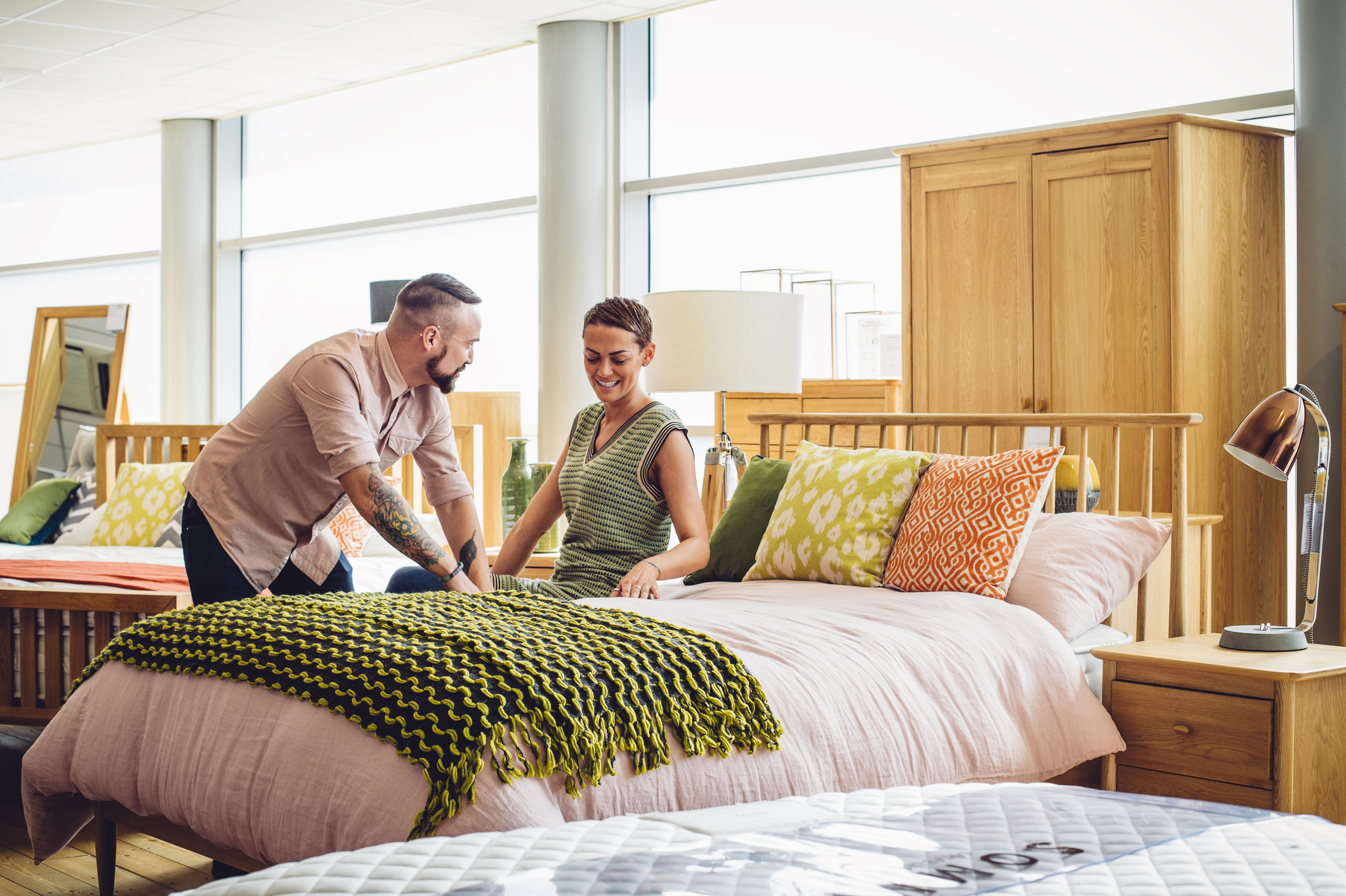 Two people shopping in a home furnishings store.