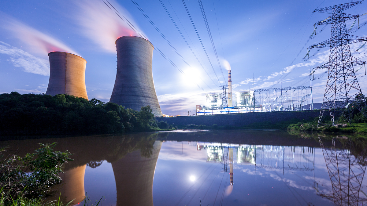 A nuclear plant with overhead electrical lines.