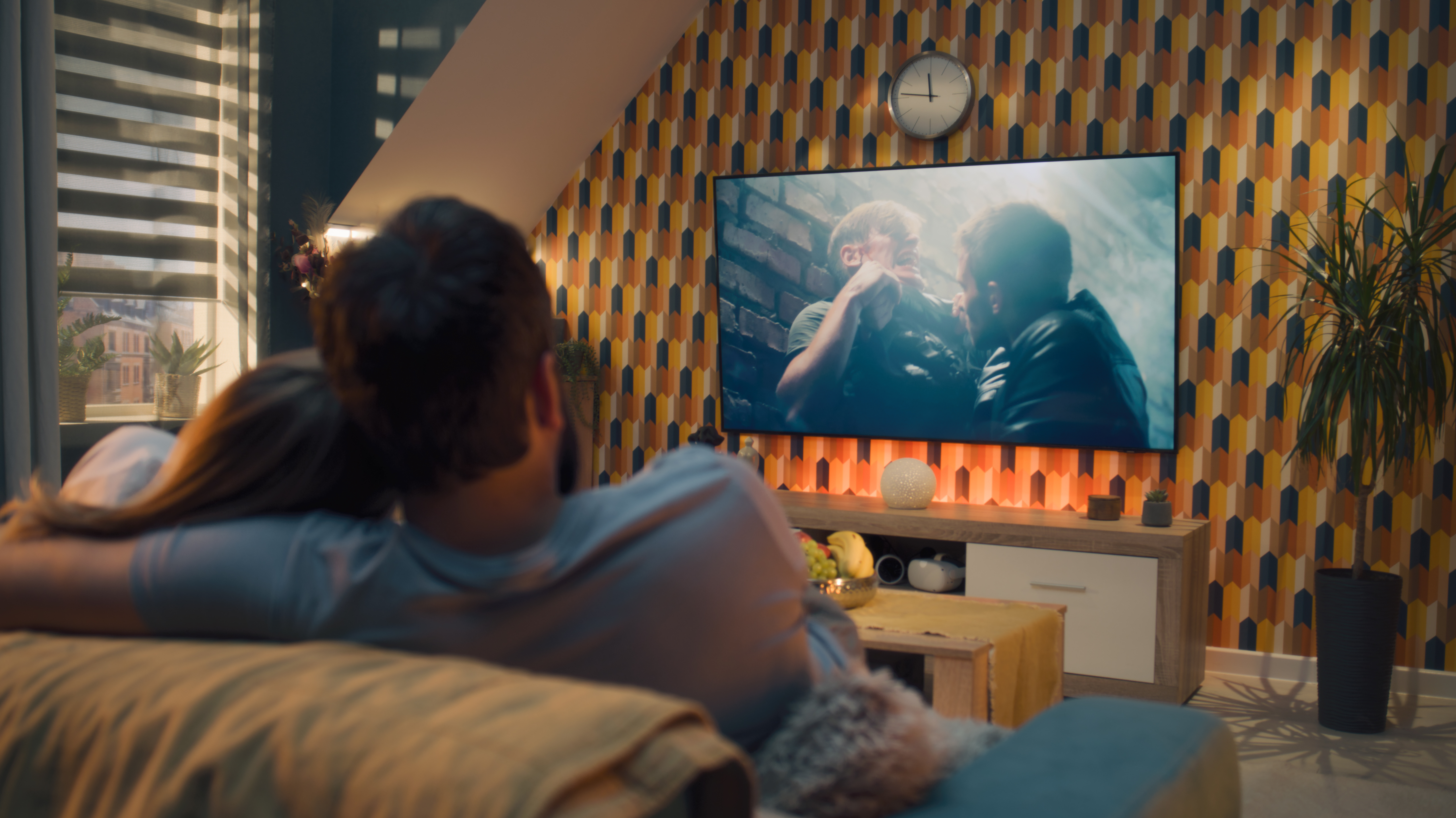 Couple watching movie on television