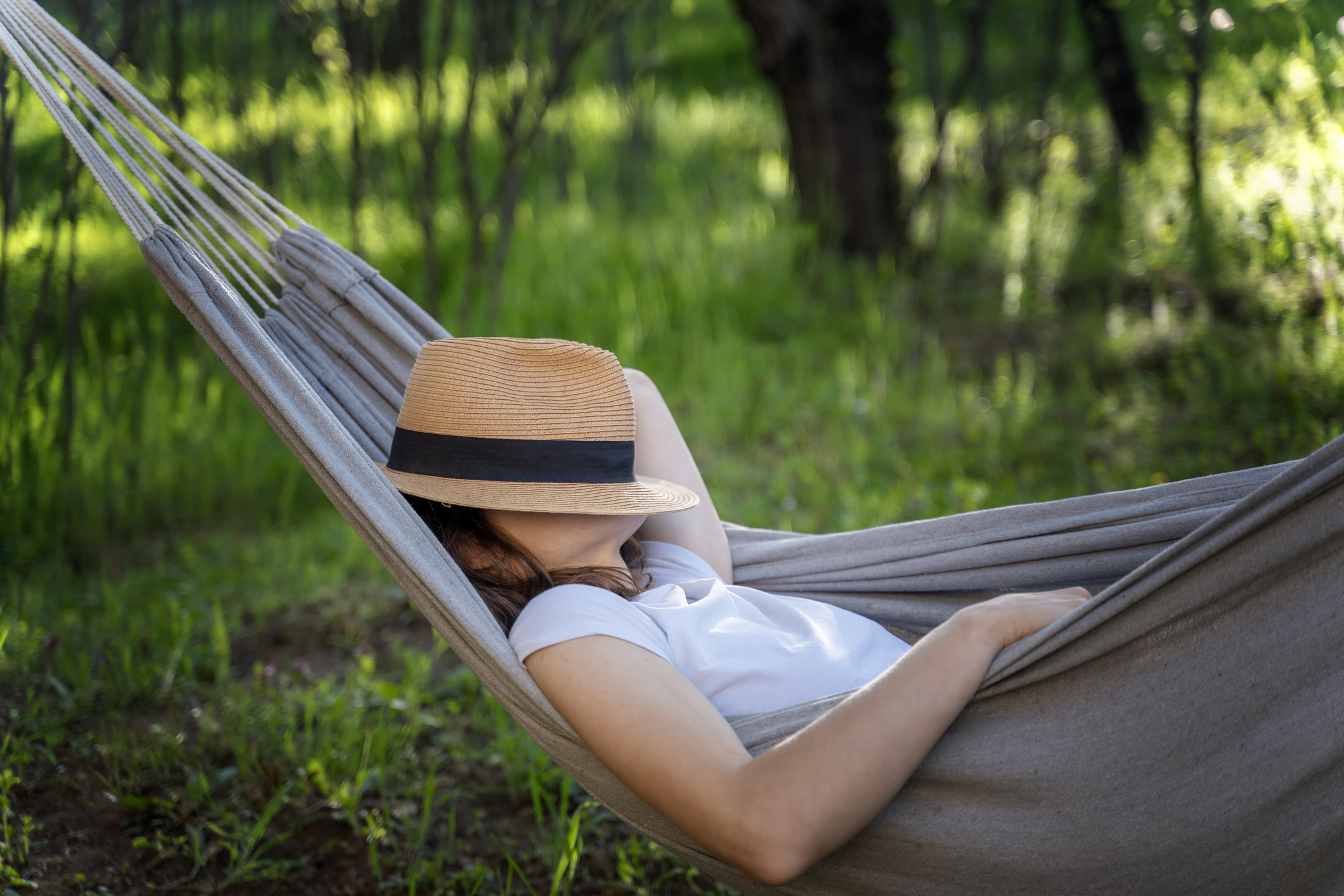 An investor relaxing in a hammock.