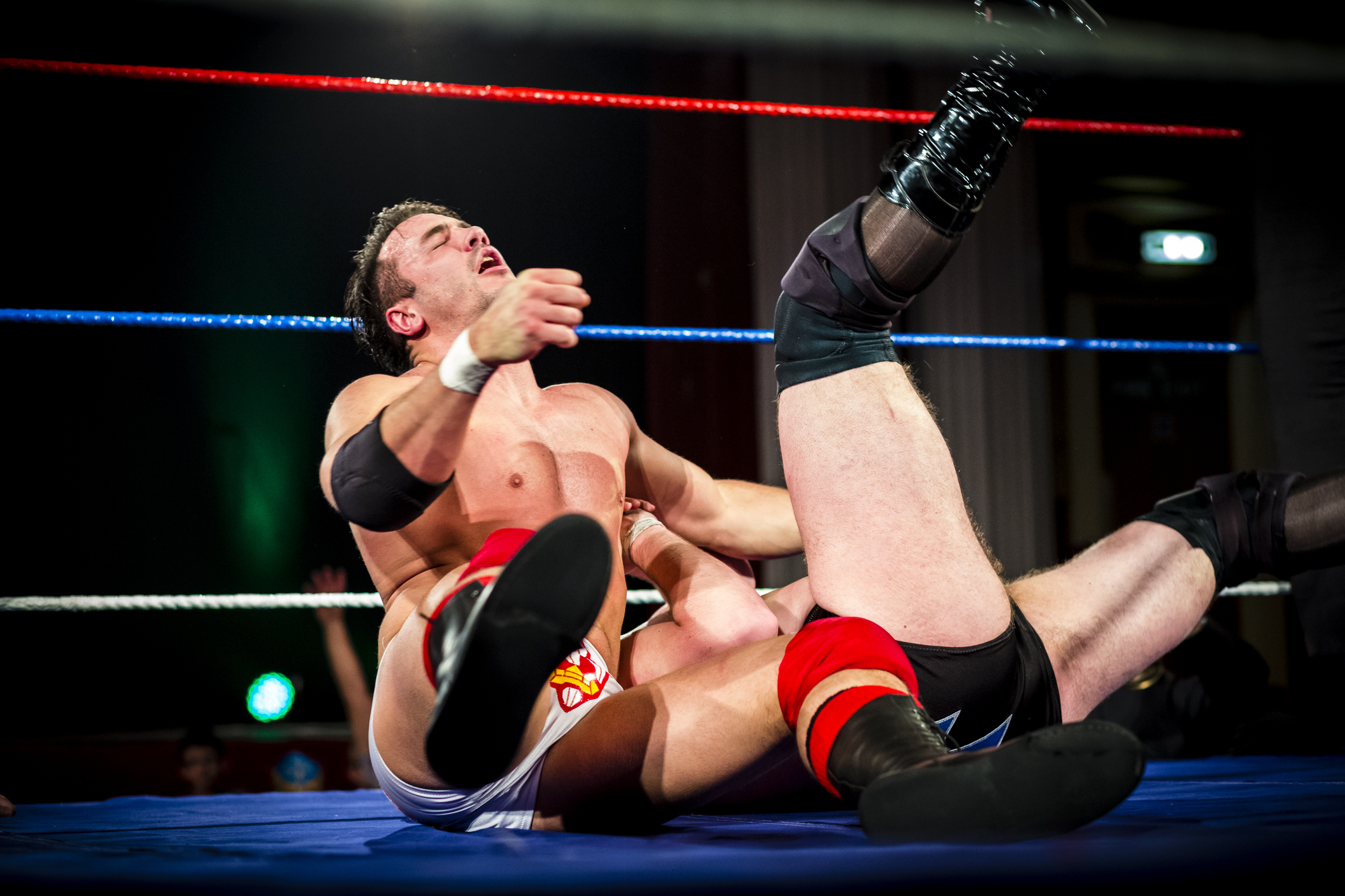 Wrestlers in wrestling ring.